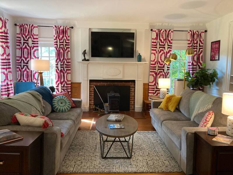 Living room with ample seating and Smart TV.