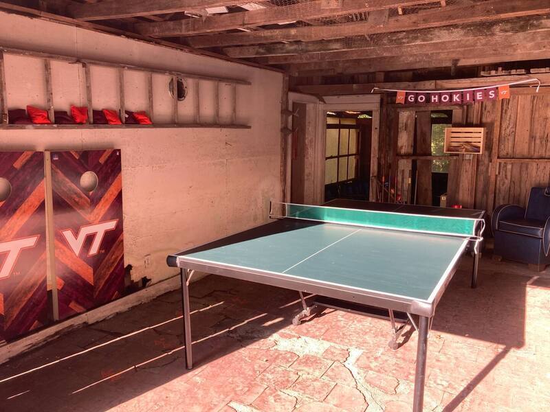 Corn hole, ping pong, and foosball in a fun side building separate from the main house.